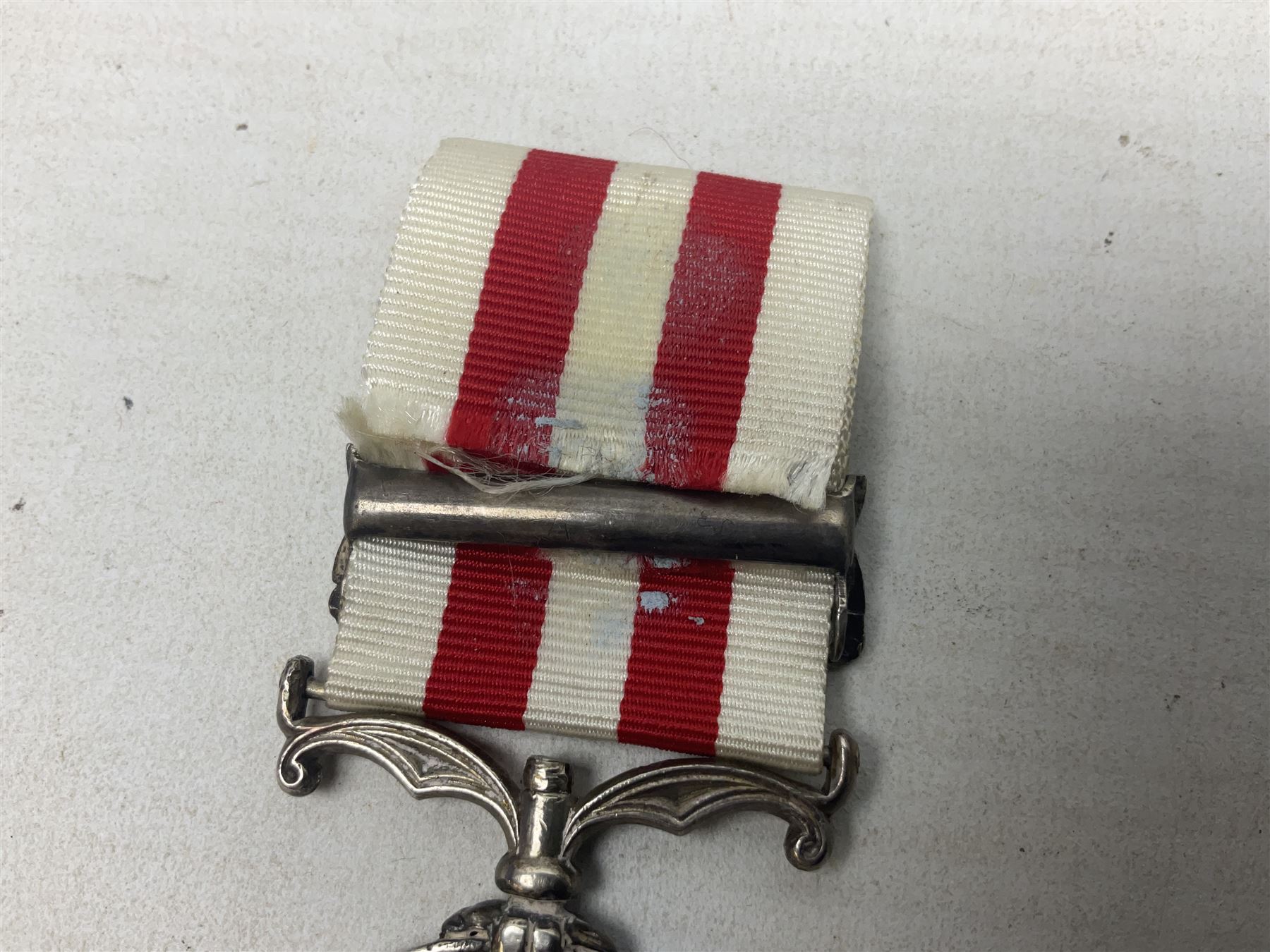 Victoria India Mutiny Medal 1857 - 1858, name erased, with Lucknow clasp and ribbon
