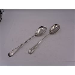 Pair of early 20th century silver salad servers, both with shaped bowls and fluted handles, hallmarked James Dixon & Sons Ltd, Sheffield 1918