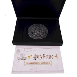 Harry Potter Wizarding World Official Coin Collection comprising twelve Samoa half dollar coins and a Harry Potter 'The Hogwarts Crest Masterpiece' medallion, cased with certificate