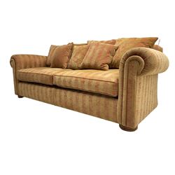 Duresta - 'Waldorf' sofa bed, traditional shape with rolled arms upholstered in red and gold striped fabric, together with scatter cushions upholstered in foliage pattern fabric