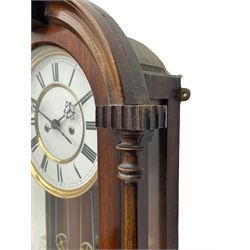 Lenzkirch – 8-day walnut cased weight driven Vienna regulator manufactured 1877-1878, with a break-arch pediment surmounted by a turned finial on a raised cavetto molding, fully glazed arched  door flanked by long ring turned pendants, flat base with open fretwork and two short pendants,  two piece enamel dial within a brass slip, Roman numerals, minute track and pierced steel hands, wooden pendulum with a brass faced bob, two brass cased weights and pulleys, dead beat escapement with a rack striking movement sounding the hours and half hours on a coiled gong, movement serial number 421410. 
Lenzkirch were one of Germanys most highly respected clock manufacturers of the 19th century, founded in the late 1850s the company produced movements and cases of high quality up until 1932.
