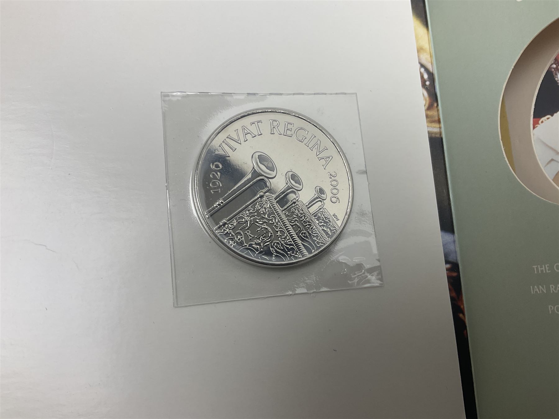 Seven Queen Elizabeth II United Kingdom five pound coins, including 2006 and 2007 in card folders, etc. 