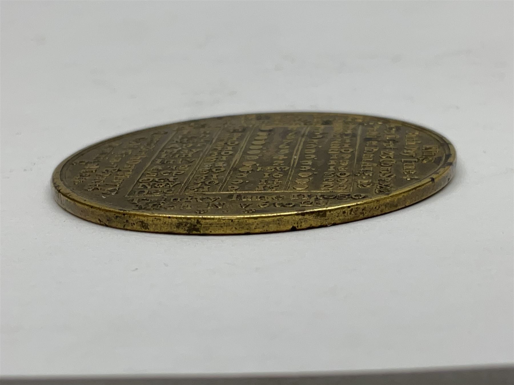 18th century brass calendar medal, for 1756, by John Powell, with moonphase calendar to reverse 