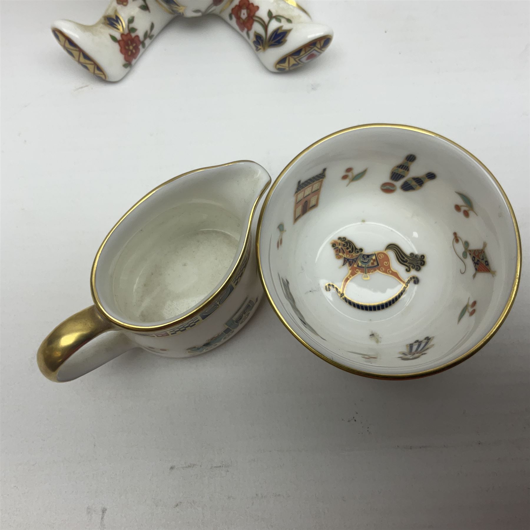 Royal Crown Derby Treasures of Childhood cabaret set, comprising tray, milk jug, sucrier, teacup and saucer, together with two Royal Crown Derby Treasures of Childhood paperweights Fleur and Ragdoll Sailor and Teddy bear paperweight, all paperweights are without stoppers