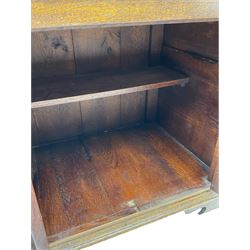 Traditional oak dresser, the moulded cornice over shaped apron, three heights plate rack fitted with two cupboards, the base fitted with six drawers and two double cupboards, panelled pointed ogee arched doors, on bracket feet