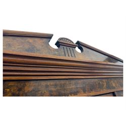 Victorian walnut bedroom suite - wardrobe, dressing chest and bedside cupboard, comprising a full-length wardrobe with broken pediment and central mirrored door, large lower drawer, a matching dressing table with bevelled swing mirror over two trinket drawers and two short drawers over two long drawers, and a single-door bedside cupboard, all with moulded edges, decorative panel work and shaped aprons