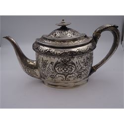 George III silver teapot, of oval form, with embossed foliate, floral and scroll decoration and engraved central cartouche, with acanthus capped C handle with ivory insulators, hallmarked John Emes, London 1807 This item has been registered for sale under Section 10 of the APHA Ivory Act
