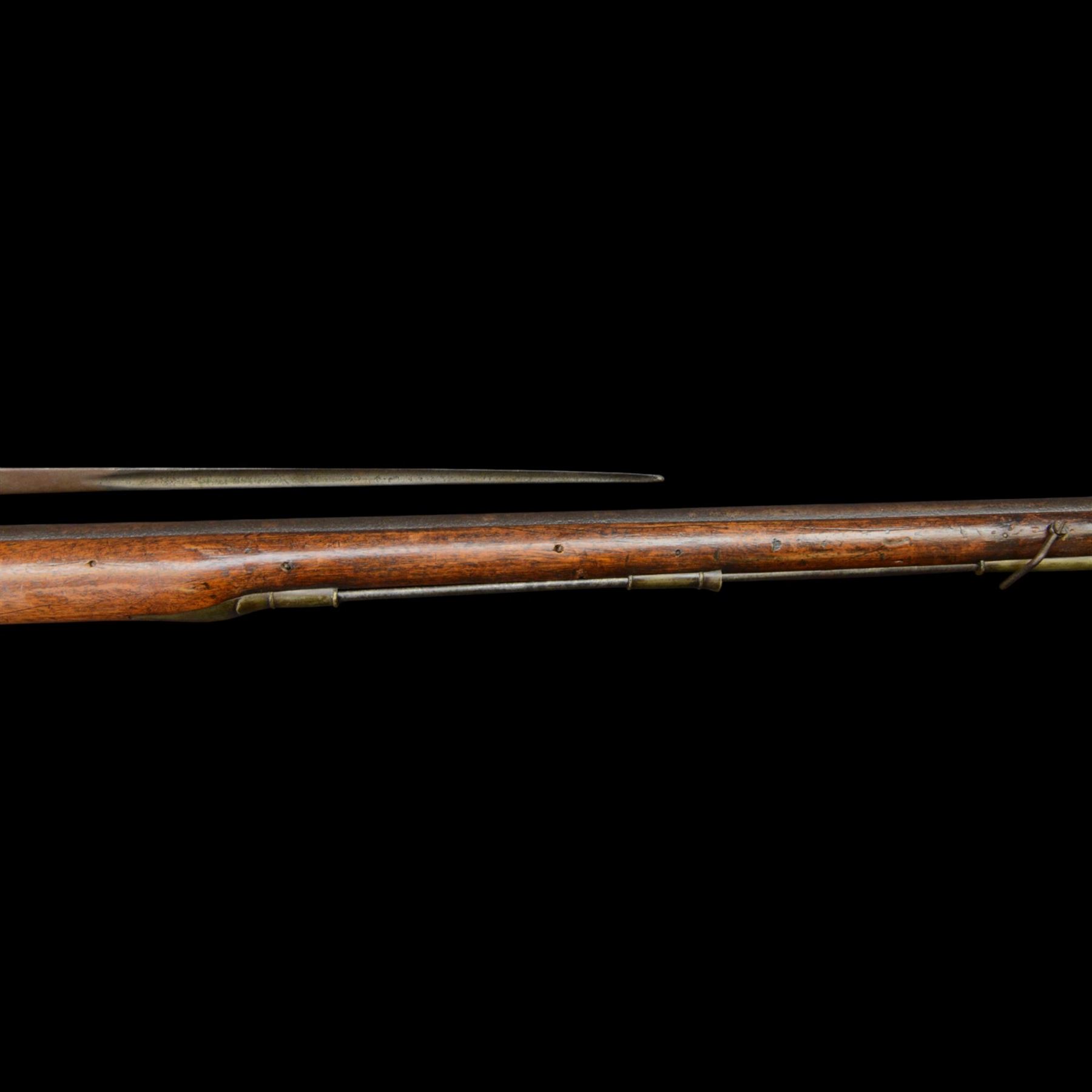 19th century 1793 Brown Bess flintlock musket, the 100cm barrel with ram rod under, full walnut stock with brass butt, carrying sling brackets, action marked Parsons and period triangular socket bayonet, L139cm
