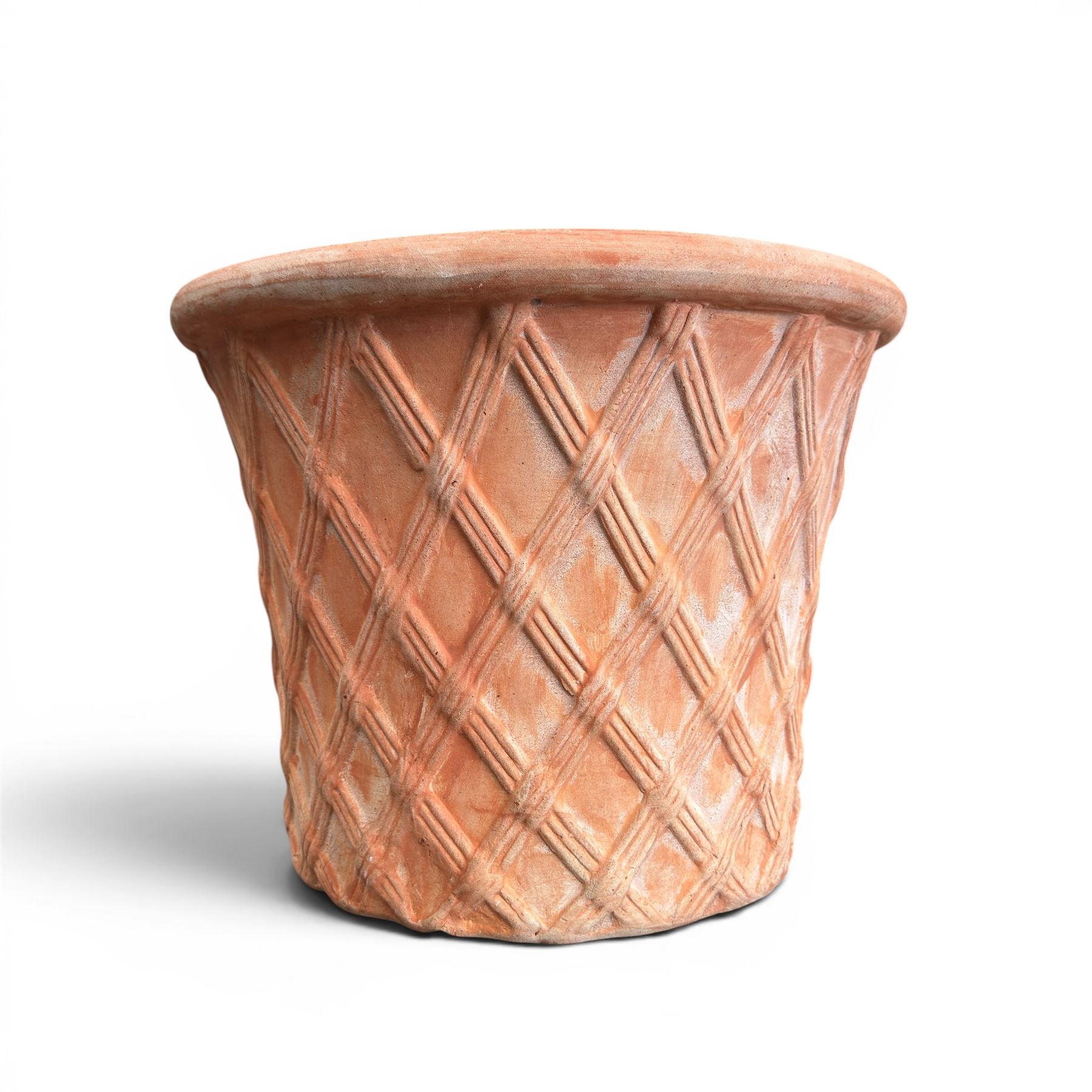 Three terracotta planters with lattice relief and rolled rim