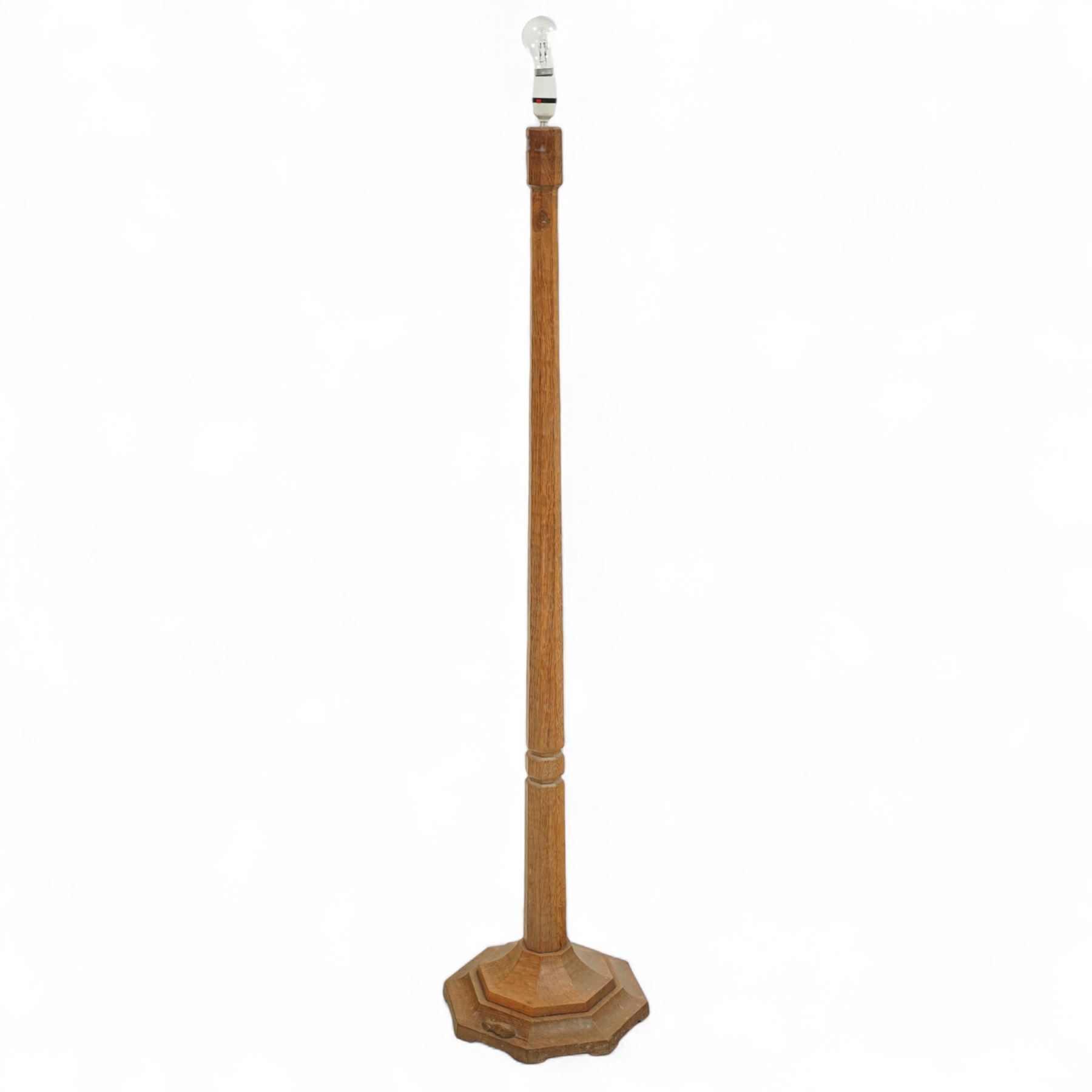 Mouseman - oak standard lamp, with octagonal tapering stem on stepped octagonal base, with signature carved mouse, by the workshop of Robert Thompson, Kilburn