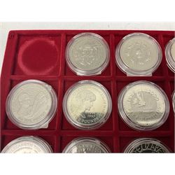 Twenty Queen Elizabeth II Great British five pound coins, housed on a coin tray