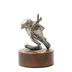 Silver model of a bird perched on a branch and with wooden base by Goldsmiths and Silversmiths Co. H5cm, small silver model of a pheasant on wooden base H2.5cm and a silver miniature model of a dog in a basket marked 925 and indistinct maker's mark L3.5cm (3)