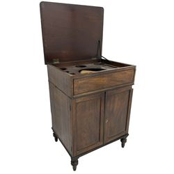 George III mahogany gentleman's dressing cabinet or washstand, reed moulded hinged top enclosing fitted interior, double cupboard below enclosed by two panelled doors, on turned feet 