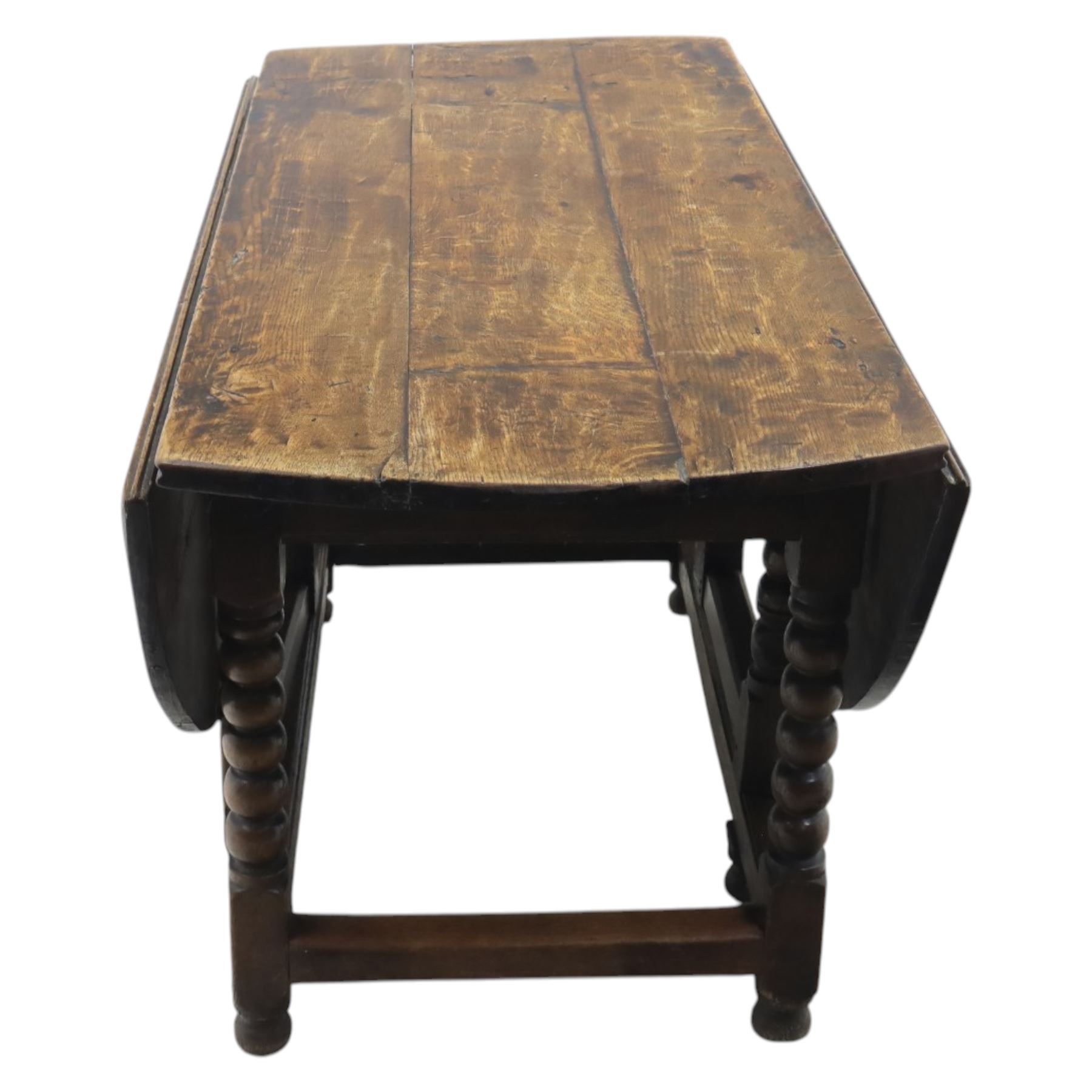 18th century country oak oval dining table, plank top with two drop leaves and gate-leg action, single drawer, raised on bobbin turned legs