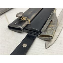 Spanish Model 1941 Bolo bayonet the 24cm steel blade marked 'NF Toledo 4992 H'; in steel scabbard marked '5828 F' L39.5cm overall; Arabian Jambiya type knife with white metal covered grip and jewelled scabbard, inscribed script to blade; and replica WW2 German dagger/knife in scabbard (3)