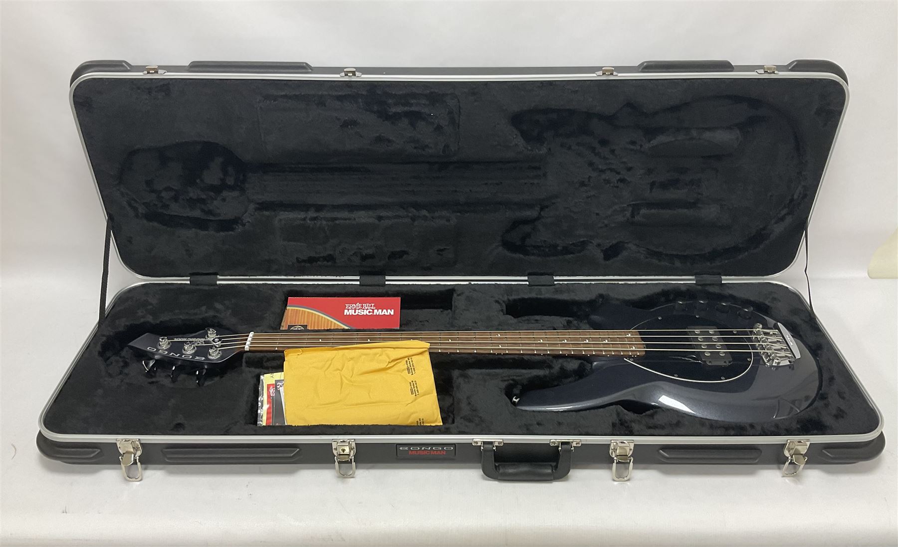 Music Man Bongo 4 string bass guitar, in sapphire black finish, serial no F42547, in black Music Man hard case, guitar L113cm