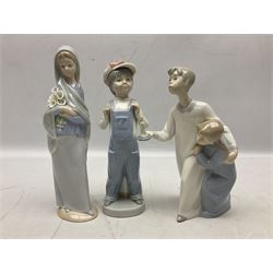 Four Lladro figures, comprising Angel Dreaming no 4961, Angel Wondering no 4962, Little Girl with Slippers no 4523, Boy and Girl in Nightgowns no 4874 and Boy From Madrid 4898