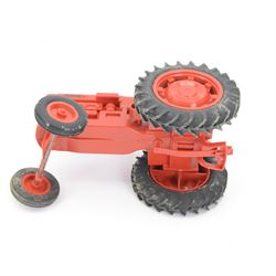 Pippin Toys Nuffield Tractor model, with red plastic body, rubber tyres and matched plastic farmer figure, in original box