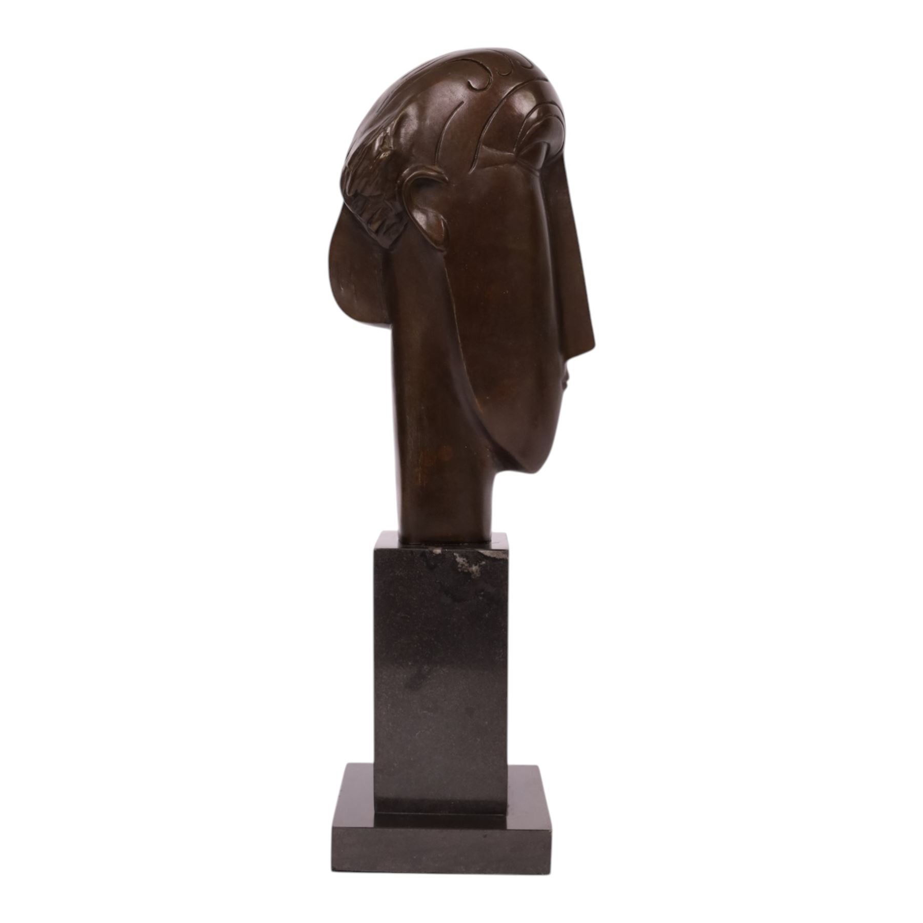 After Amedeo Modigliani - bronze sculpture modeled as a female face, upon a square base, overall H38cm