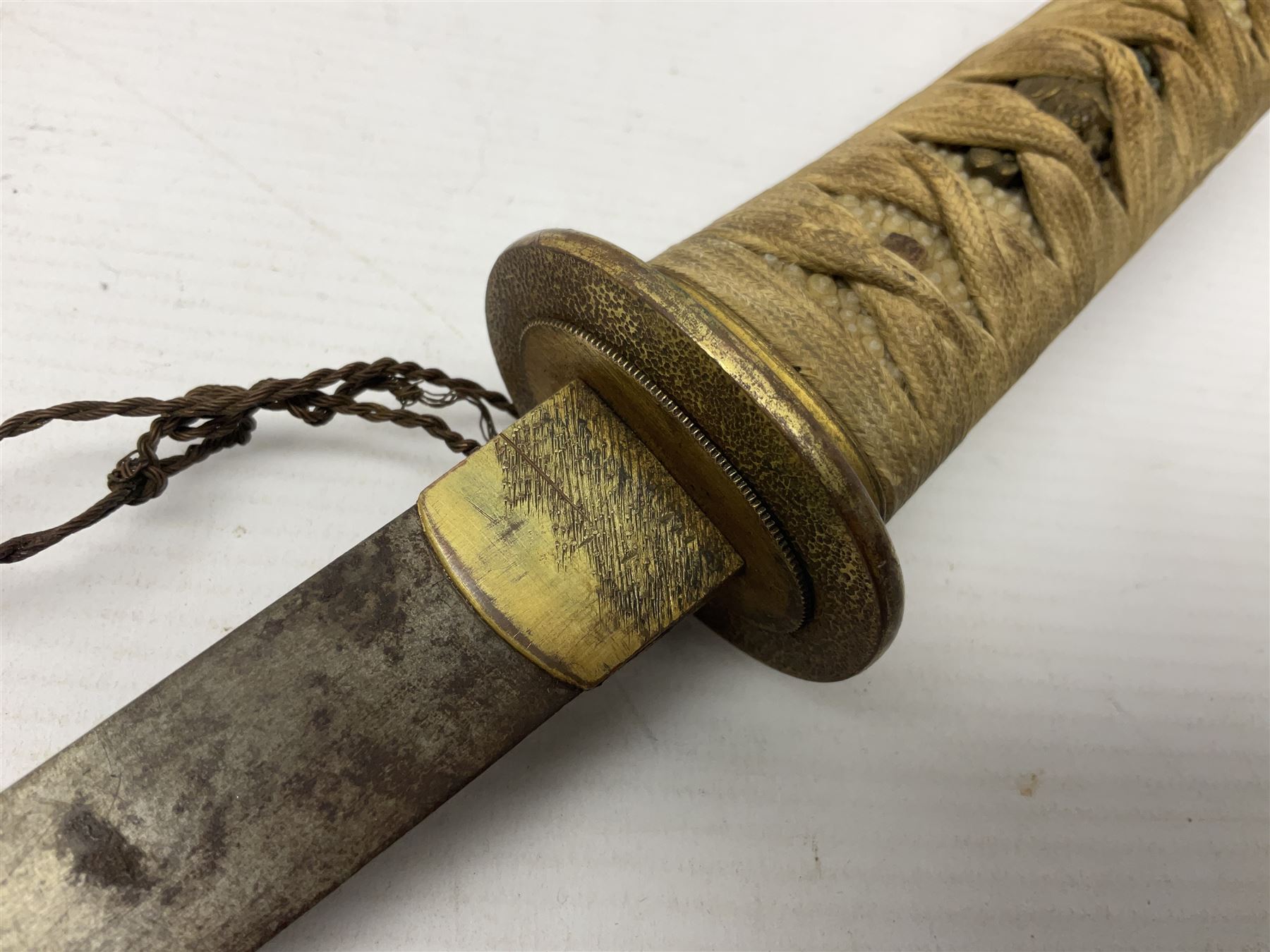 Japanese tanto dagger with 25cm single edged blade, gilded plain punched tsuba, cord bound ray skin grip incorporating menuki and ornate gilded metal mounts L39cm overall