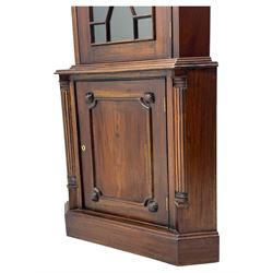 Late 20th century mahogany corner cabinet, dentil moulded cornice above a glazed door with astragal glazing enclosing two shelves, lower cupboard with fielded panel door and turned shell motif, on plinth base