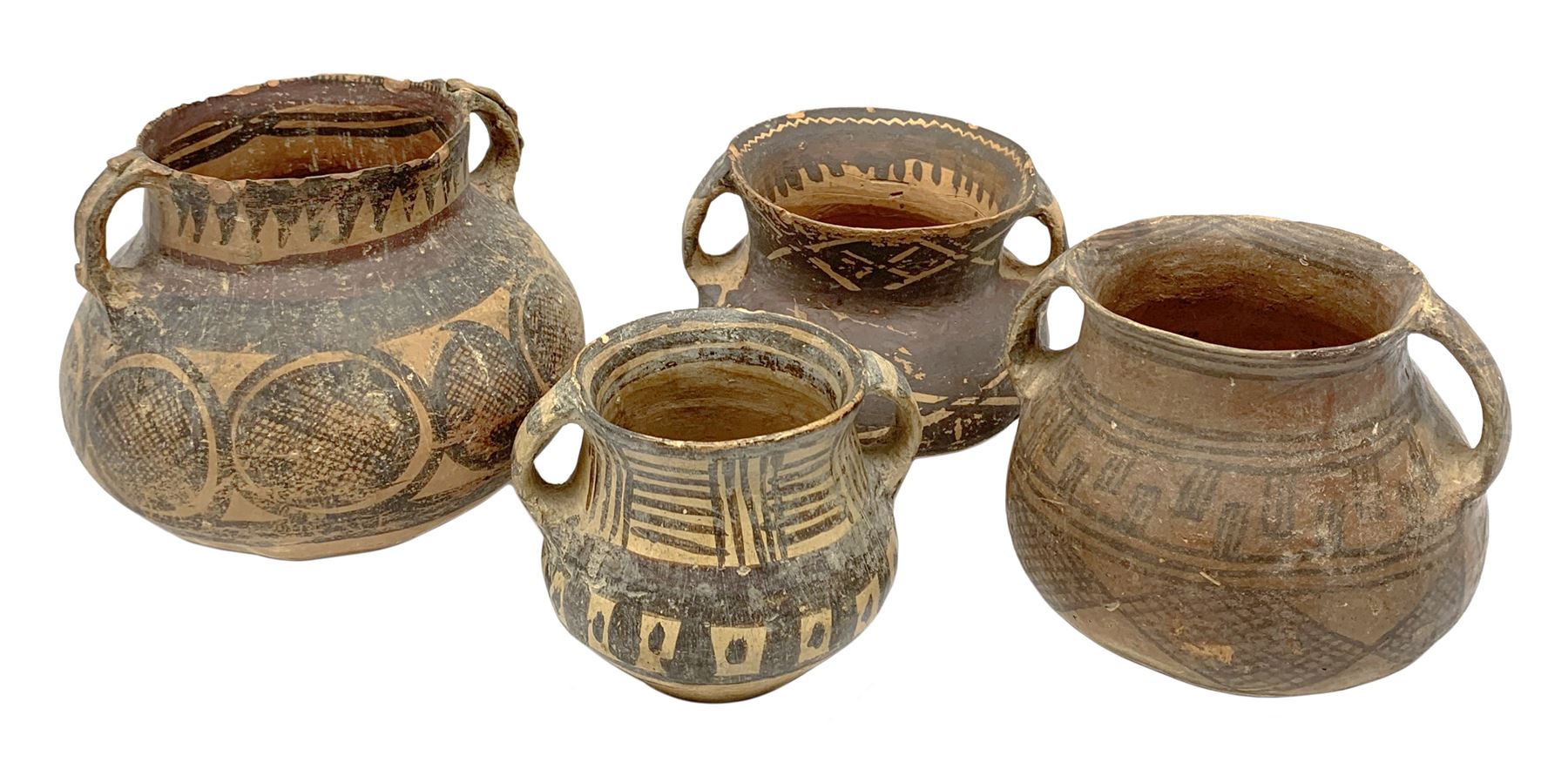 Four Chinese Neolithic pottery vessels, each with twin loop handles to the shoulder and painted geometric banded decoration to the body, three bearing labels for Eskenazi London, tallest H13cm