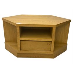 Contemporary light oak corner television stand, hexagonal top with central open section and lower drawer, shaped sides on integral plinth
