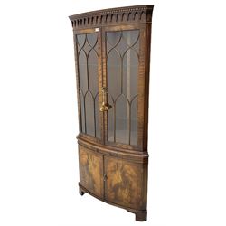 Bevan Funnell 'Reprodux' Georgian style figured mahogany bow front double corner display cabinet, two glazed doors above drinks slide and two cross-banded doors