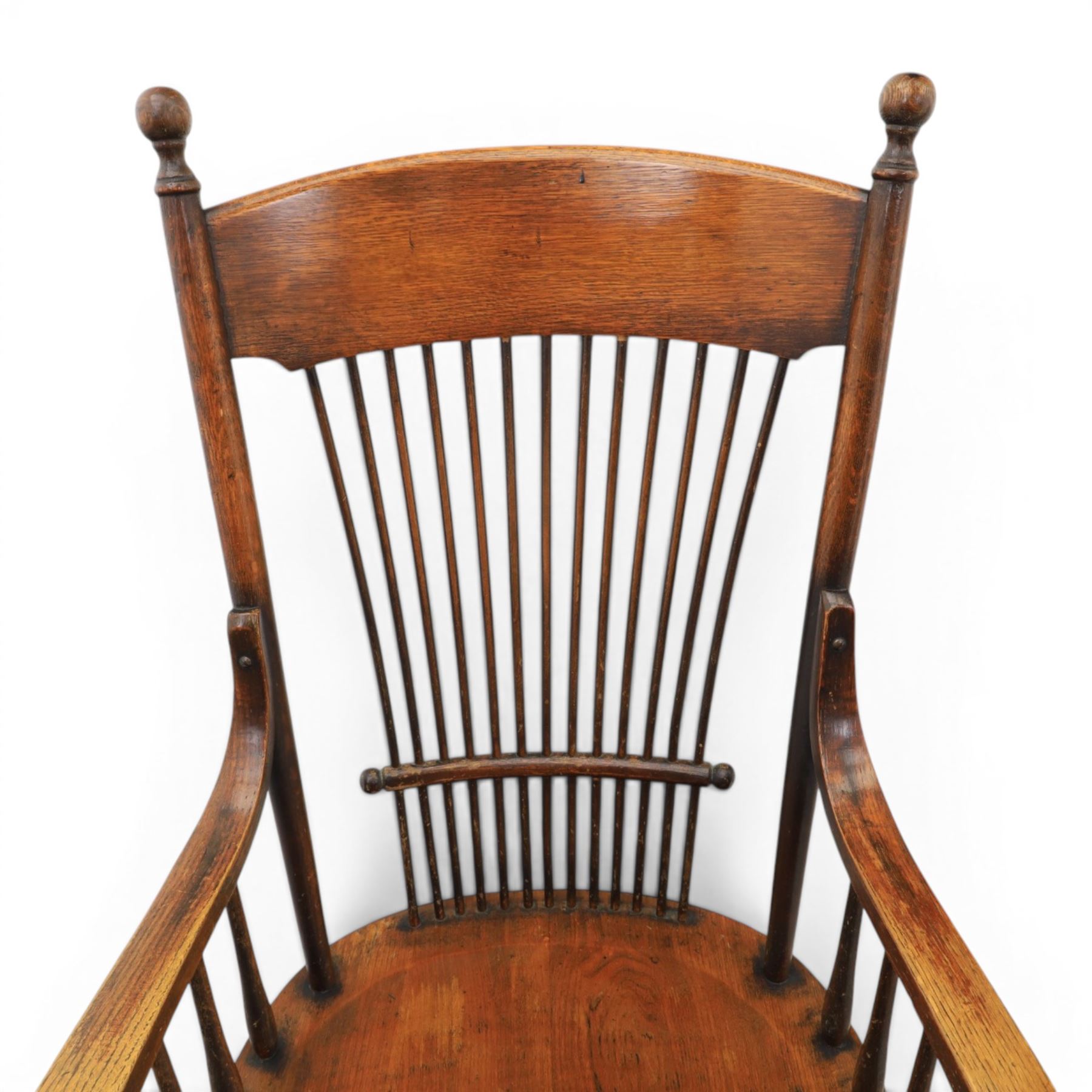 Set of three 19th century ash and elm spindle back Windsor armchairs, arched top rails above fan-shaped spindle backs, curved arms with turned supports, shaped saddle seats, on turned legs joined by H-stretchers