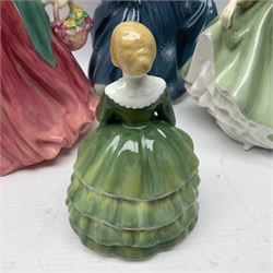 Four Royal Doulton figures, comprising Lady Charmain HN1949, Belle HN2340, Fair Lady HN2193 and Fragrance HN2334
