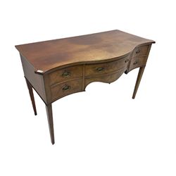 George III mahogany serpentine sideboard, fitted with four drawers, on tapering supports