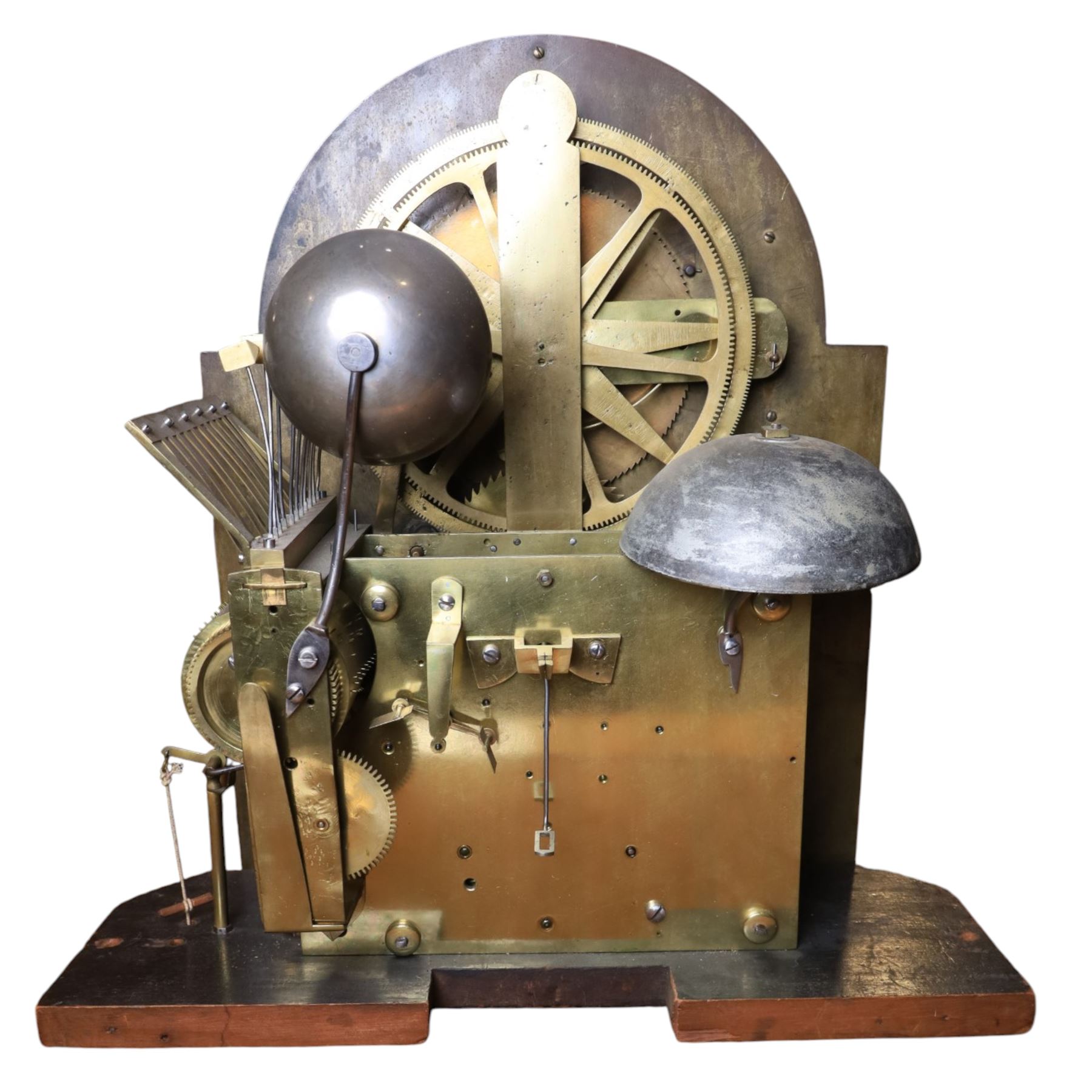 Late nineteenth century ebonised and gilt-bronze mounted musical longcase clock of impressive architectural form, the case of ebonised finish with applied gilt bronze neoclassical inspired masks and mounts, hood of arched form with glazed door, flanked by free fluted columns with gilt bronze Corinthian capitals surmounted by stylized Lion finials, frieze and arch enriched with applied foliate mounts, trunk with a rectangular glazed door bordered by mouldings and flanked by engaged columns with gilt bronze mounts above a shaped projecting base panel with applied central female mask and corner foliate ornamentation, arched brass dial, with a silvered chapter ring and applied cast gilt bronze spandrels and arch decoration, incorporating subsidiary selection dials for chime/silent and tune regulation, offering Cambridge chimes on eight bells and an additional chime sequence on ten bells, brass arch is further embellished with a moon phase aperture with lunar calendar scale, Zodiac symbols, month and date indication on a silvered dial, substantial eight-day, three-train movement with pinned cylinder musical train and a graduated nest of eleven bells with eleven hammers, quarter chiming with separate hour/half-hour strike and chime repetition, movement is regulated by an anchor escapement, with brass disc pendulum, three brass weights, two winding keys and case door key