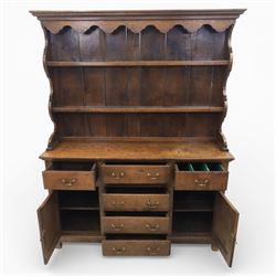 Georgian design oak dresser, the raised plate rack with shaped sides and two open shelves, upon a dresser base fitted with six drawers and two cupboard doors, and short block feet 