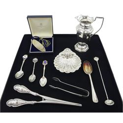 Edwardian silver cream jug by Mappin & Webb Ltd, Sheffield 1905, silver scallop dish, silver bookmark, silver sugar tongs, silver teaspoons and silver handled glove stretchers, all hallmarked or stamped