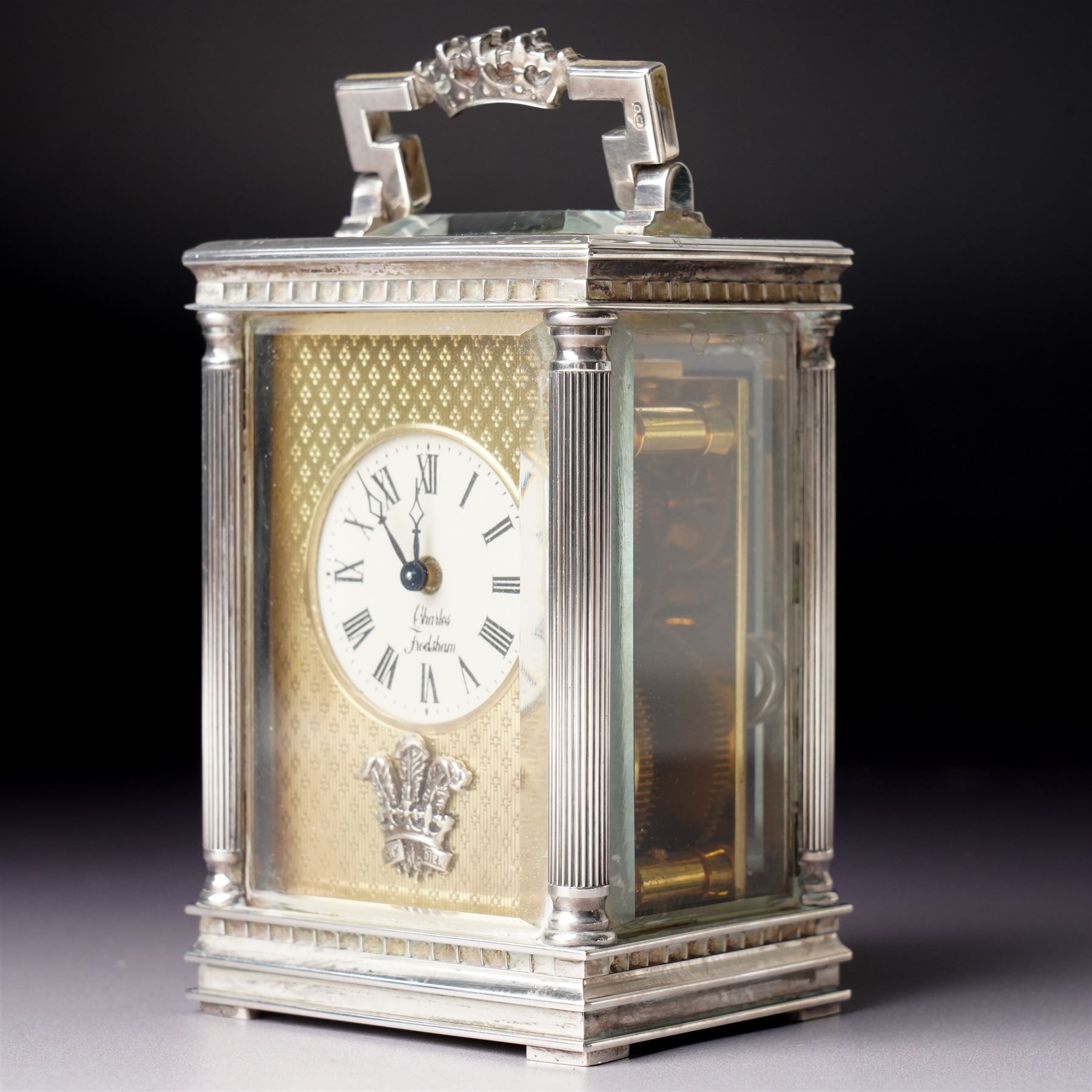 Chas Frodsham -  Miniature carriage clock with platform lever escapement commemorating the marriage of Prince Charles and Lady Diana Spencer, the white dial with an engine turned gilt surround and fleur de lis in silver case with fluted columns and bevelled glass panels H10cm  No.43/1000 London 1981 with key