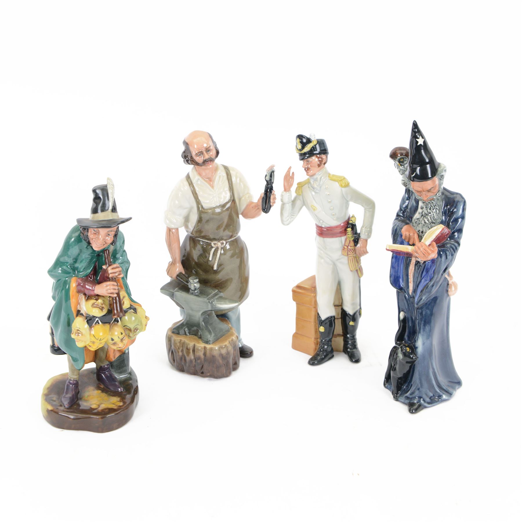 Four Royal Doulton figures, comprising The Mark Seller HN2103, The Wizard HN2877, The Blacksmith Arms HN2782, Morning Ma'am HN2895 