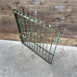 19th century French cast iron garden gate, finished in green rustic paint, bar form with hoop and spear top, with loop hinge brackets