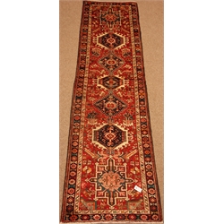  Karajeh black and red ground runner, repeating border, 330cm x 80cm  