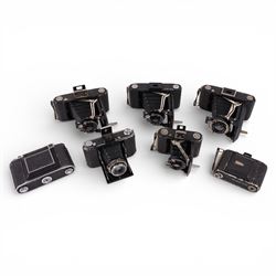 Collection of Zeiss Ikon folding cameras, including Telma, Ikonta and Super Ikonta models