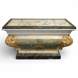 A 20th century Italian Neoclassical console table of architectural pedestal form, inspired by Roman architectural prototypes, with marble top and simulated marble scagliola-type finish; the rectangular marble top with grey veining within a black and yellow marble border, above a pedestal base finished in a finely executed faux-marble surface and enriched with parcel-gilt scrolling acanthus terminals, floral garlands, a central ribbon-tied motif in relief, and further raised flowerheads and a central gilt monogram, terminating in a stepped plinth base
