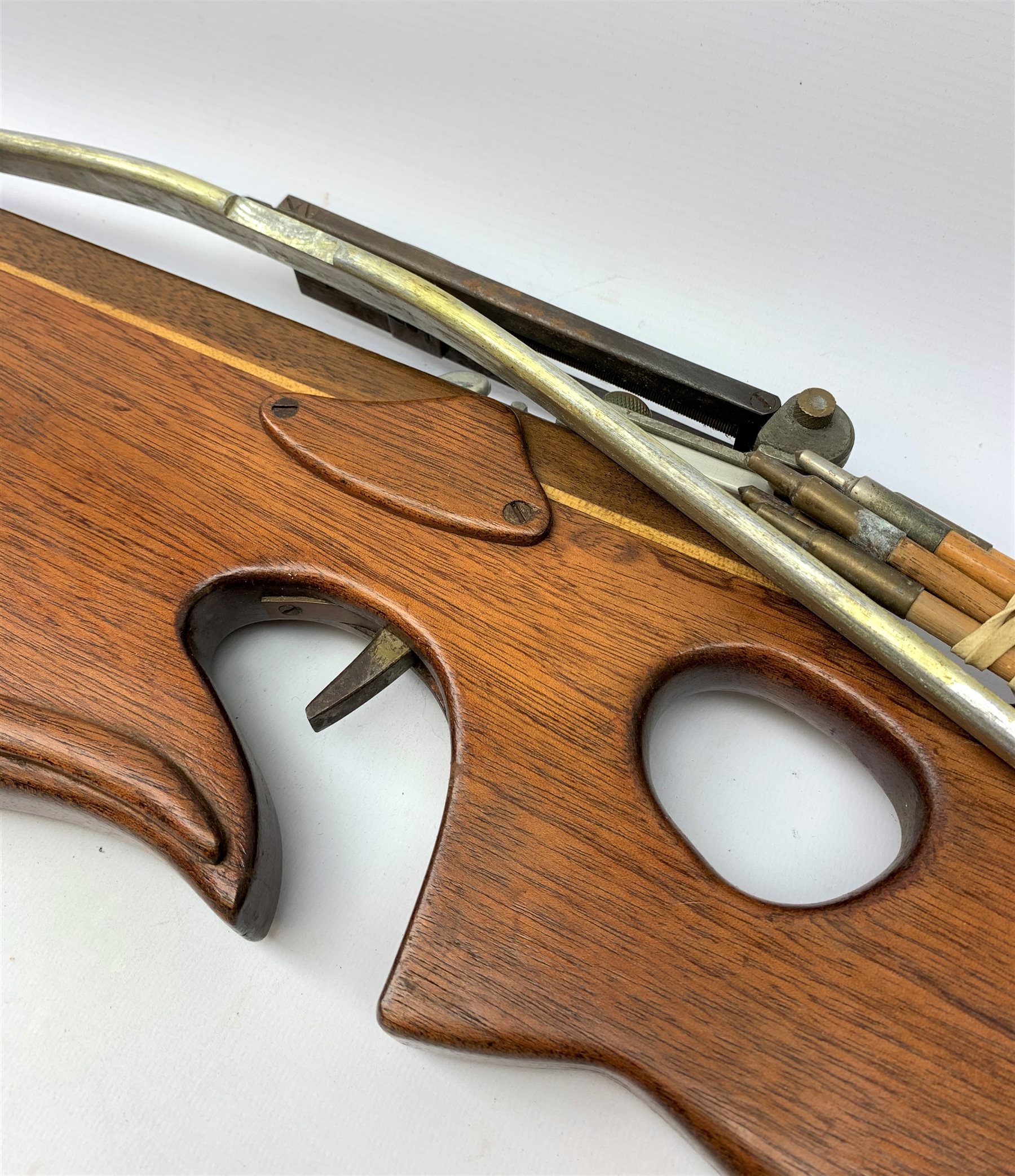 20th century crossbow with sectional mahogany shaped stock and Nikko Stirling telescopic sight L89cm; together with another similar with hinged foresight; and six arrows (8)
