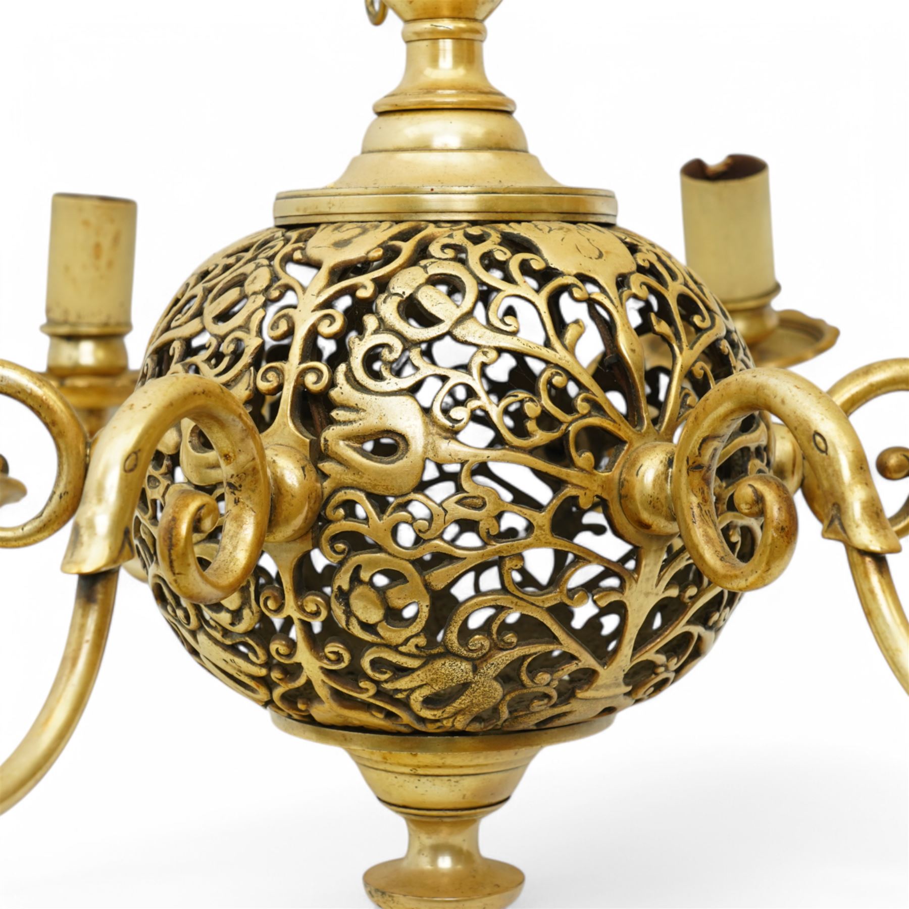 Art Nouveau pierced globe and six branch chandelier, each scrolled branch holding a single candle-style bulb holder and fitted bobeche, with four matching sconces, chandelier H55cm