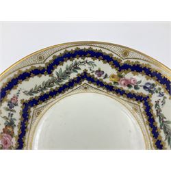 Sèvres soft paste porcelain coffee can and saucer with date code for 1767, painted with floral and laurel leaf garlands within blue scalloped and gilt borders, interlaced LL monogram enclosing the date letter O above painters mark for Catrice, coffee can H7.5cm, saucer D15cm