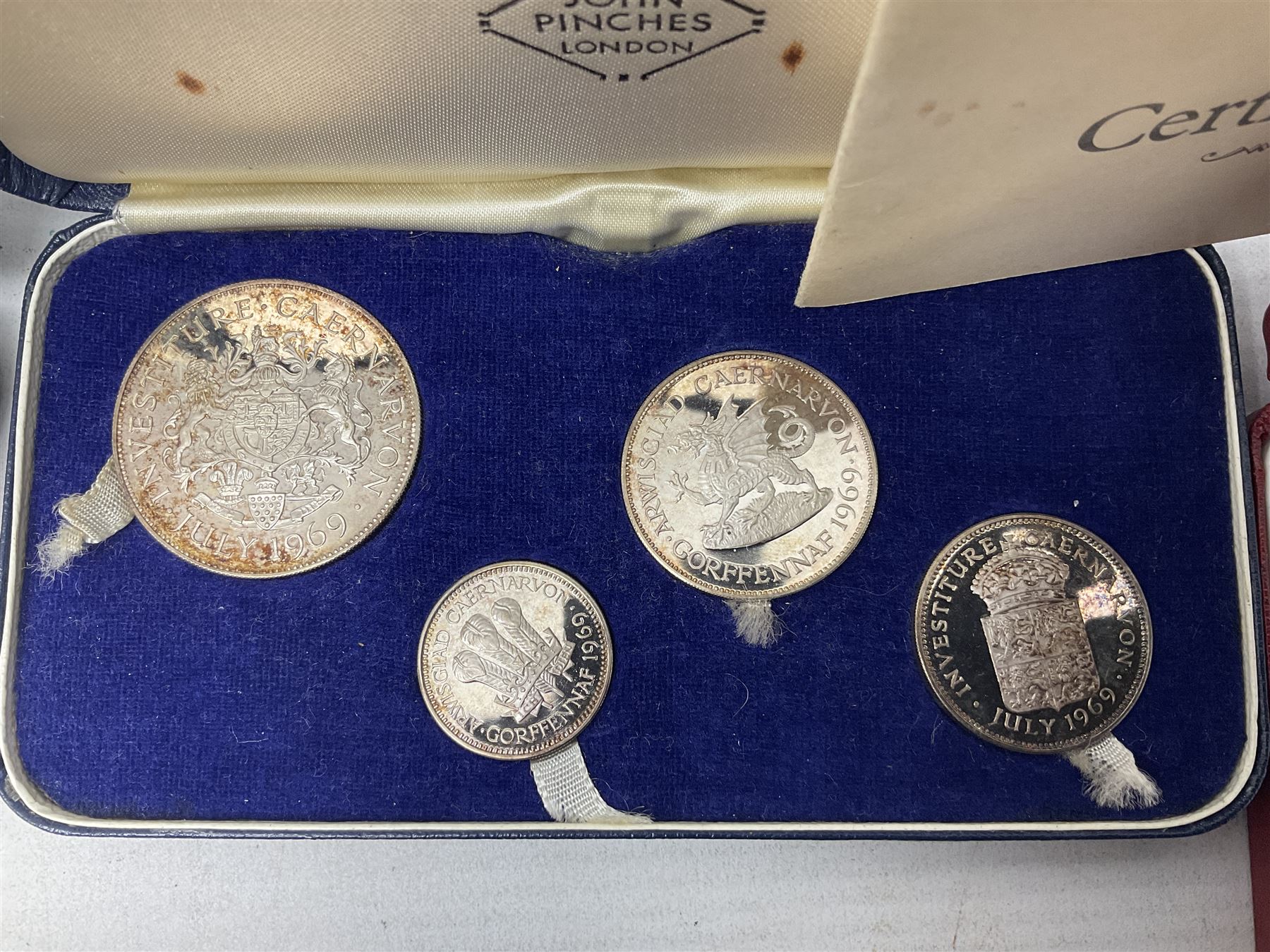 Commemorative coins and medallions, including hallmarked silver poultry medal, Royal Mint 'College of Arms Quincentenary Commemorative Medal', Selby Abbey '1069 1969' medallion, two medallions commemorating the Investiture of H.R.H. Prince Charles 1st July 1969 and a set of four coins commemorating the Investiture of Prince Charles, all cased 