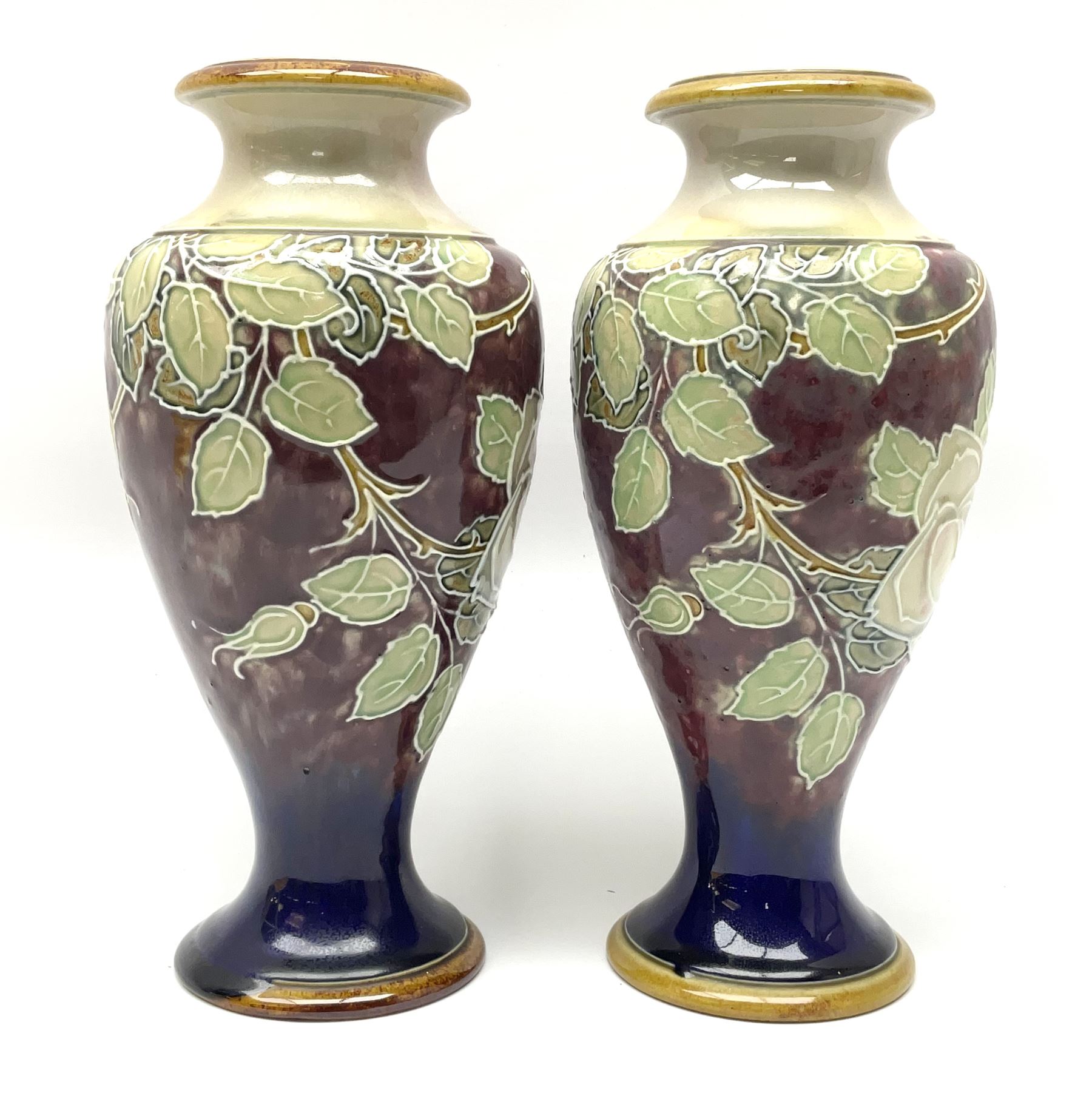 A pair of early 20th century Royal Doulton stoneware vases, of baluster