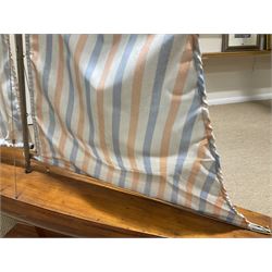 Large pond yacht with simulated planked mahogany deck, mahogany hull, wooden keel and stern fin and tubular aluminium mast with two sails; on wooden stand L131cm H on stand 177cm