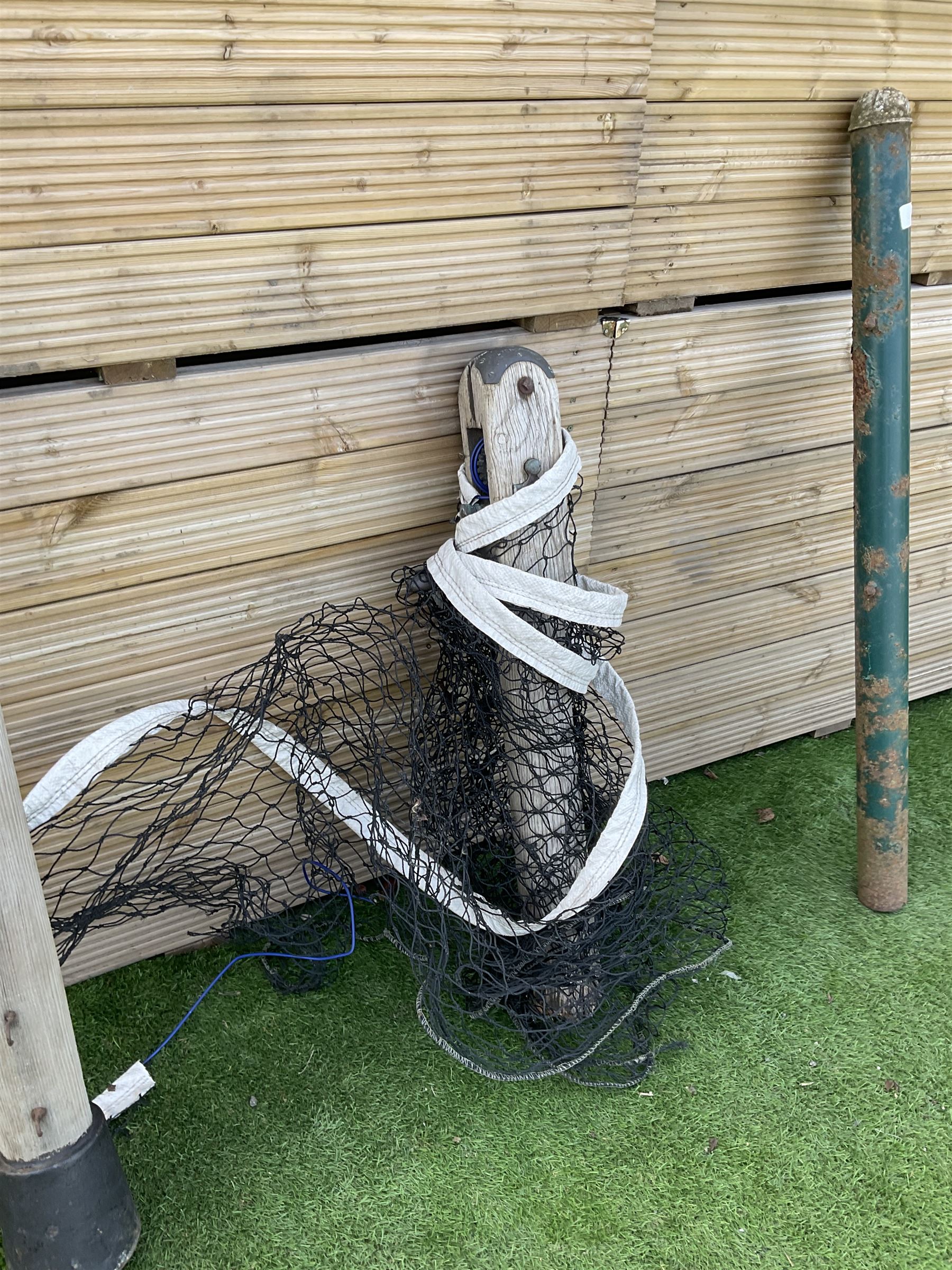 Pair of Edwardian cast iron and wood tennis posts, with net - THIS LOT IS TO BE COLLECTED BY APPOINTMENT FROM DUGGLEBY STORAGE, GREAT HILL, EASTFIELD, SCARBOROUGH, YO11 3TX