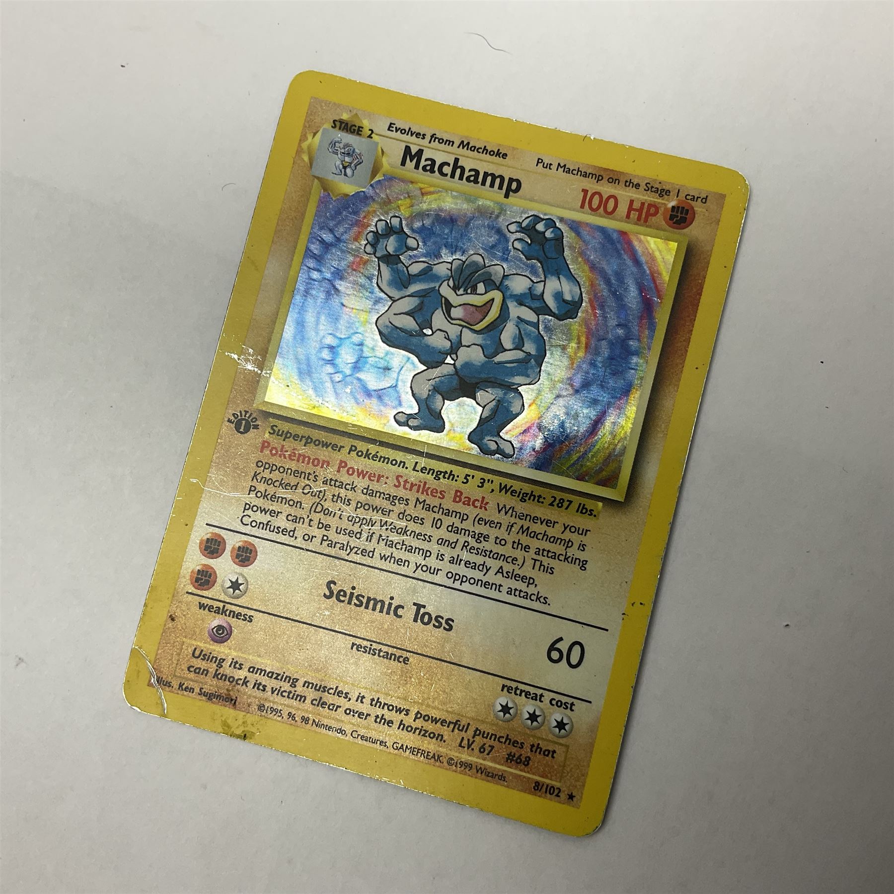 Collection of Pokemon trading cards, mostly 1999 Wizards Pokemon cards to include holo Charizard 4/102, first edition holo Machamp 8/102, further holographic cards; Dark Flareon 35/82 and Dark Vaporeon 45/82, cards from themed sets and 4th edition prints; 1998 Electronic Pokédex with cardboard boxes for themed decks Blackout, Overgrowth and Power Reserve Jungle, along with a large quantity of energy and trainer cards 