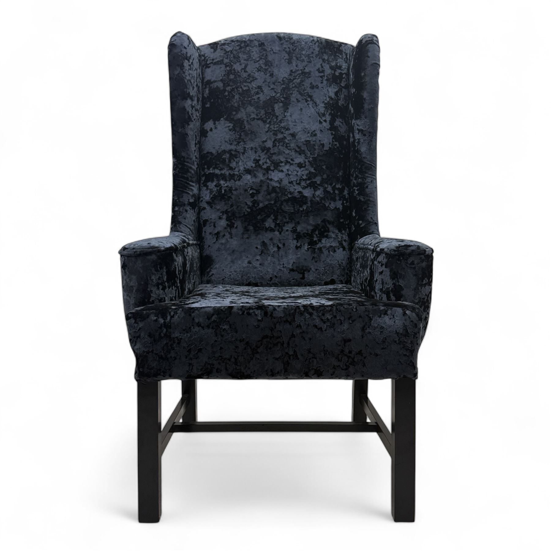 Oka - Pair of contemporary upholstered wingback armchairs, in black and blue textured velvet effect fabric, with tall scroll wing sides and square tapered legs joined by stretchers