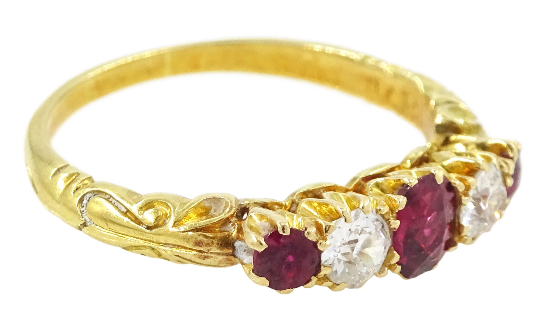Early 20th century 18ct gold ruby and diamond five stone ring, three oval and round cut rubies, spaced by two old cut diamonds, stamped 18, total ruby weight approx 0.55 carat, total diamond weight approx 0.30 carat